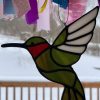 stained glass hummingbird, green, red, and white