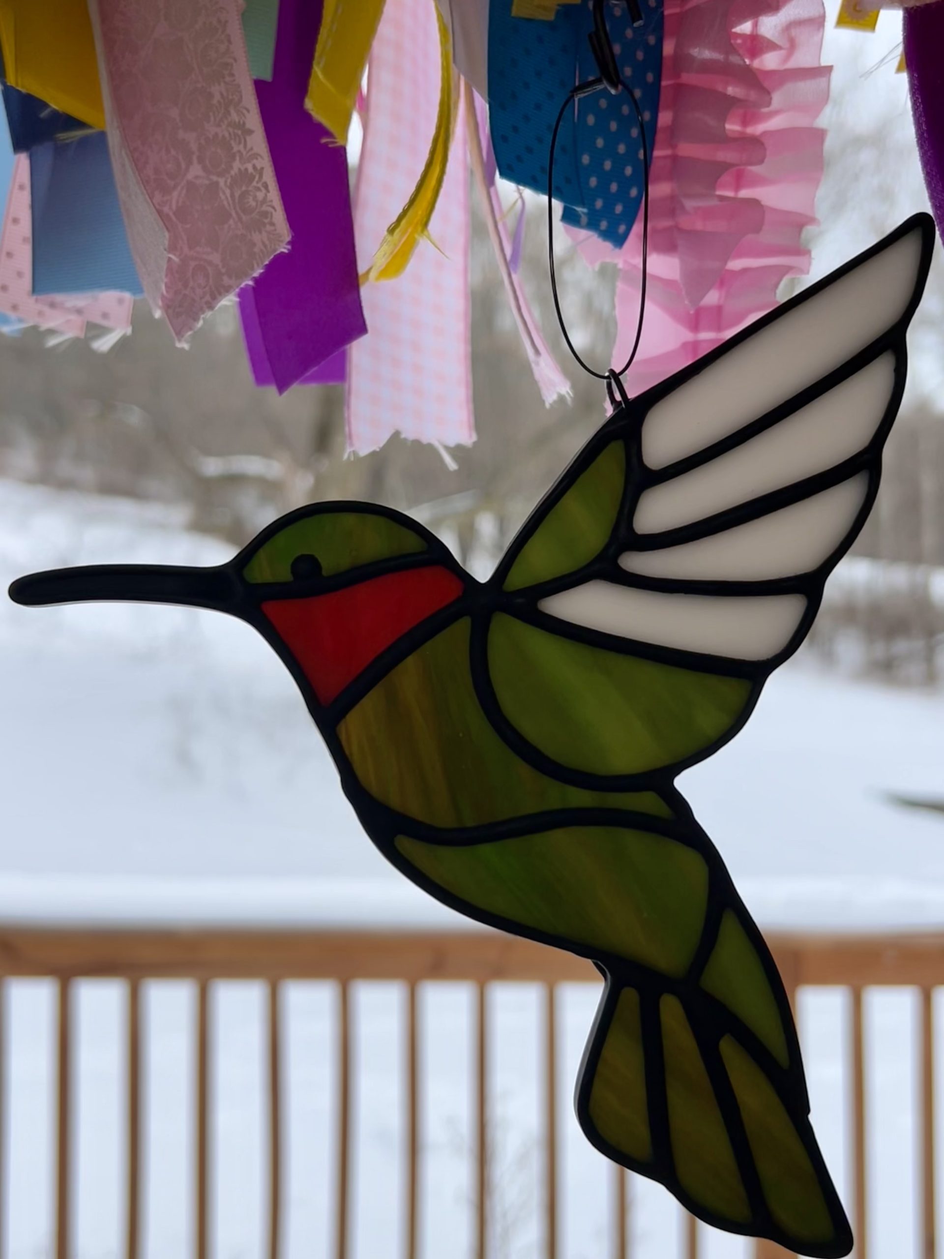 stained glass hummingbird, green, red, and white