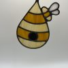 amber and dark amber striped bee hive sun catcher.