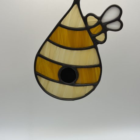 amber and dark amber striped bee hive sun catcher.