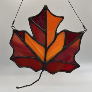 orange and red maple leaf stained glass sun catcher